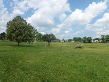 Swings, benches, and other playground equipment at Belmont Park.