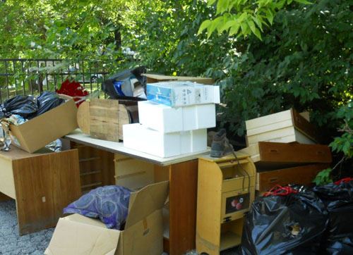 Pile of old dressers, drawers, and other bulk items.